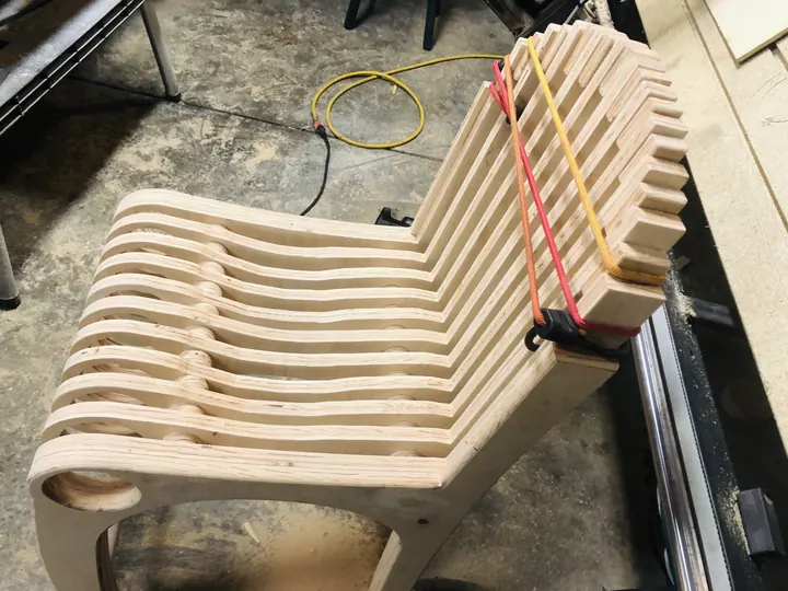 A lounge chair built from many parallel plywood slices